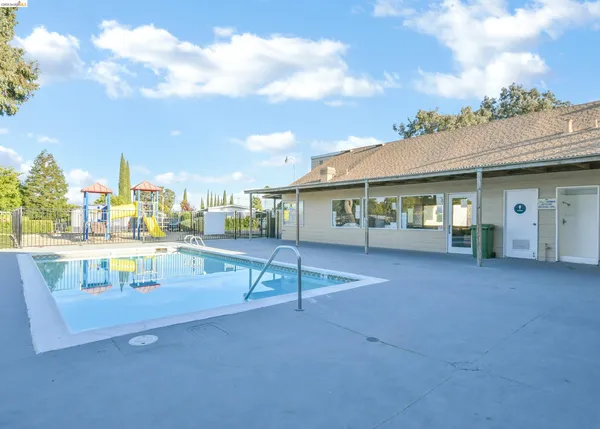 a view of swimming pool with outdoor seating