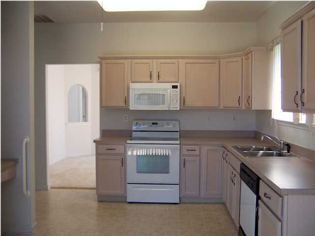 59 Drayton Road Manchester Township, NJ 08759 - Photo 3 of 3 a kitchen with stainless steel appliances granite countertop a stove and a refrigerator