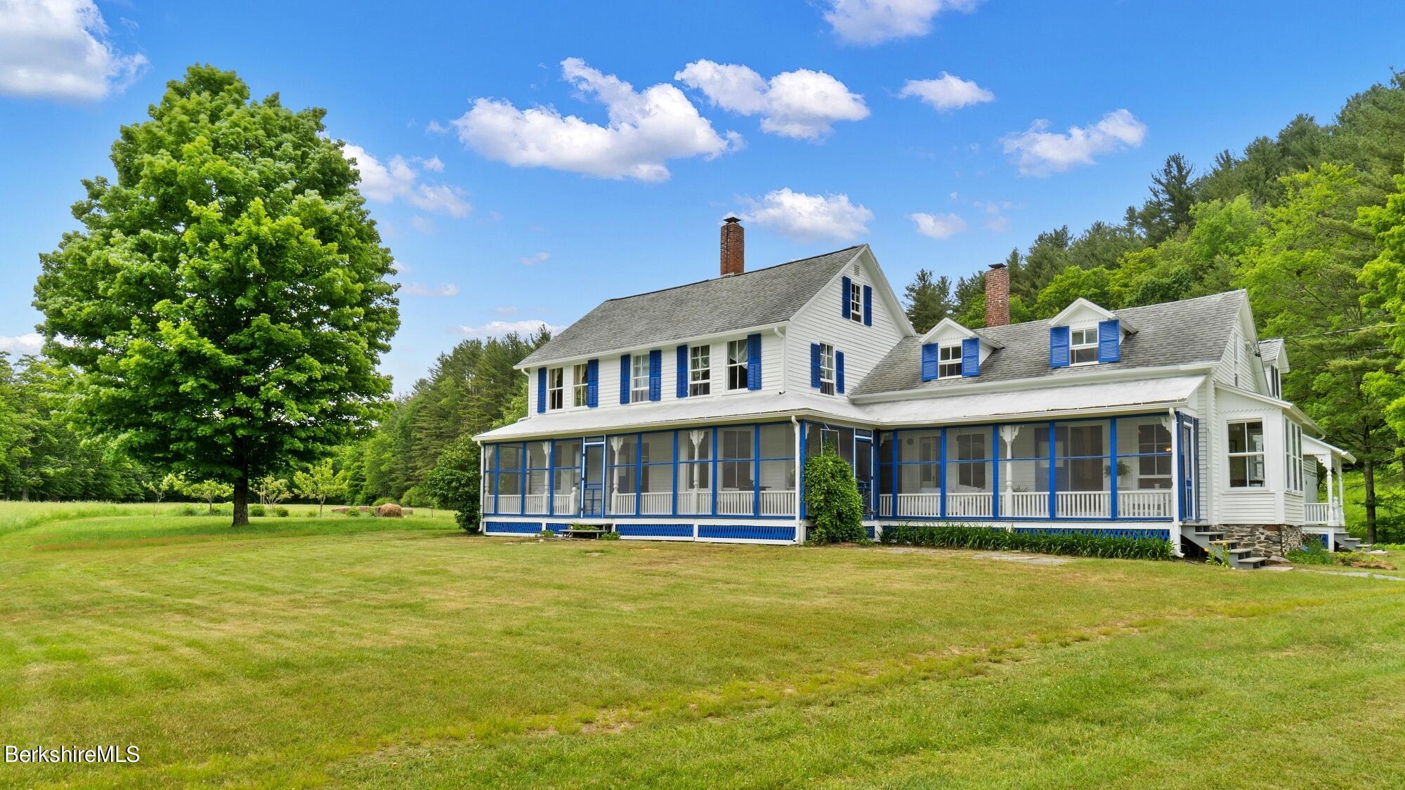 601 East River Road Chester, MA 01050 - Photo 1 of 49 a house view with swimming pool and garden space