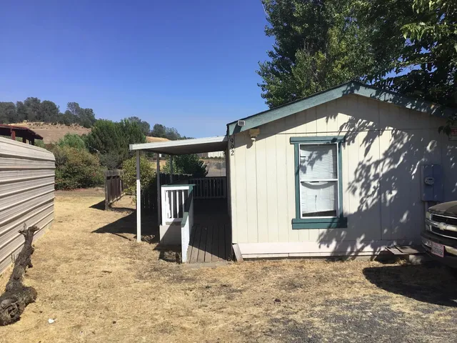 a view of a house with a snow in the yard