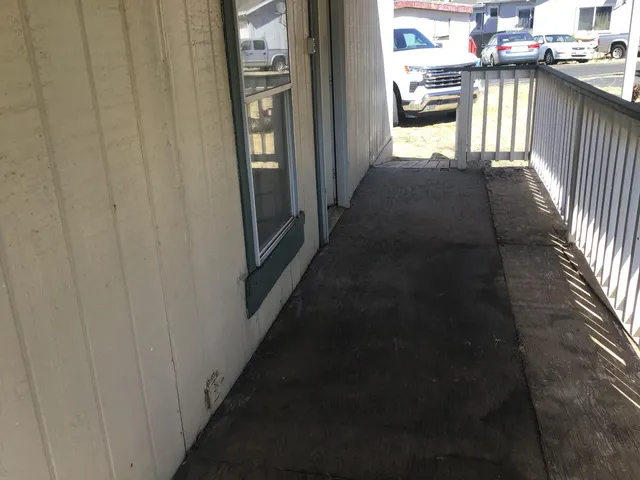 a view of a hallway with a dining table