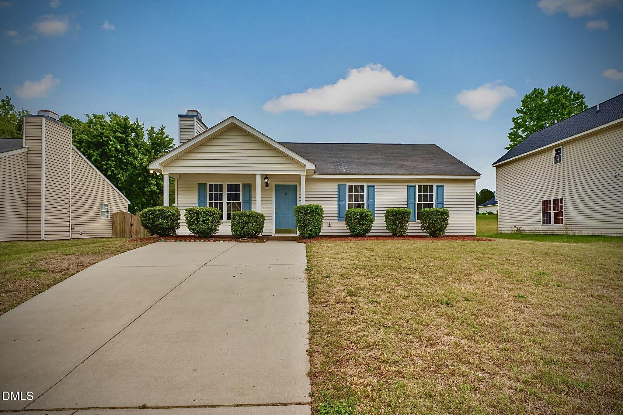 5415 Gunnette Drive Raleigh, NC 27610 - Photo 1 of 37 a front view of a house with a yard