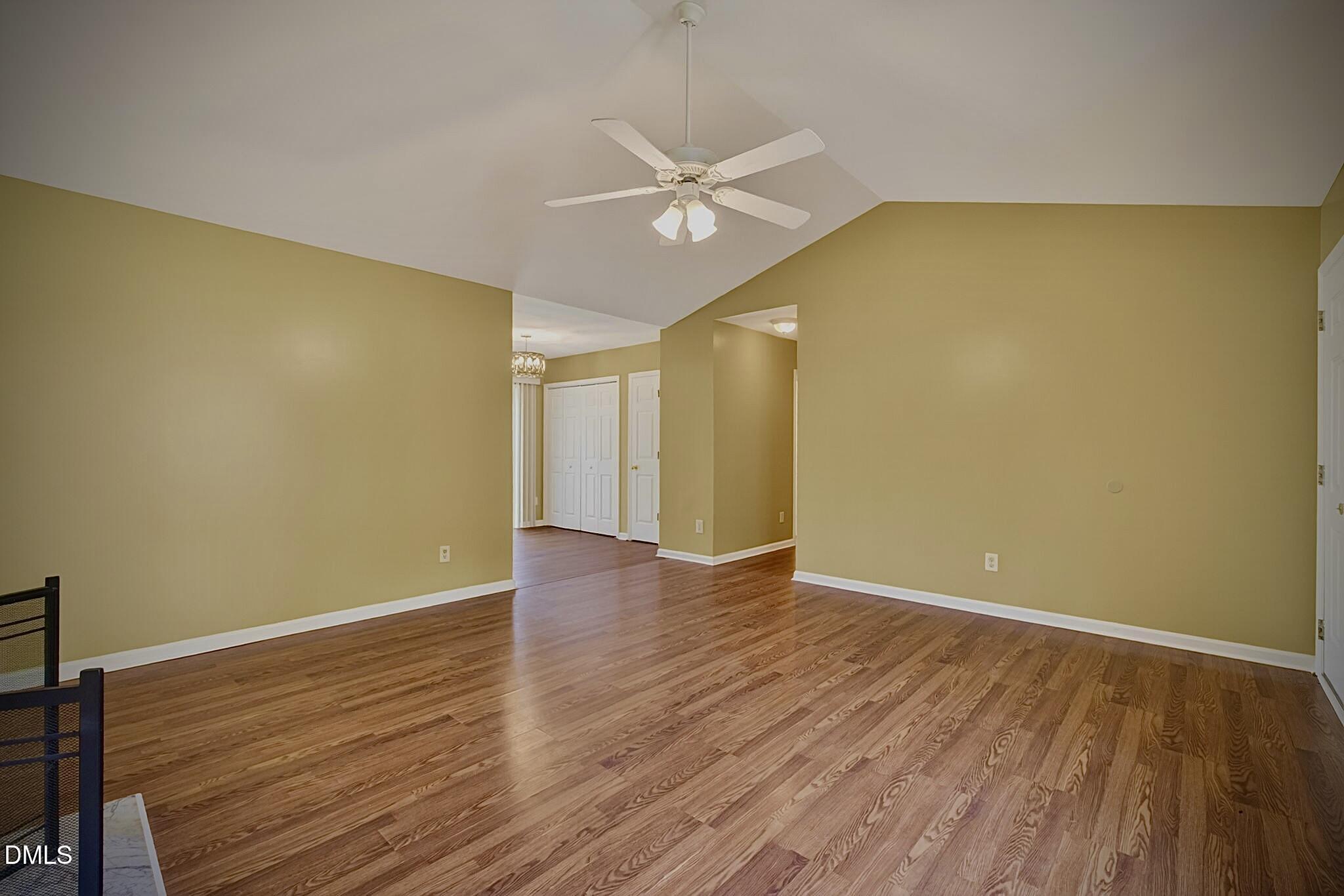 5415 Gunnette Drive Raleigh, NC 27610 - Photo 19 of 37 a view of a big room with wooden floor and windows