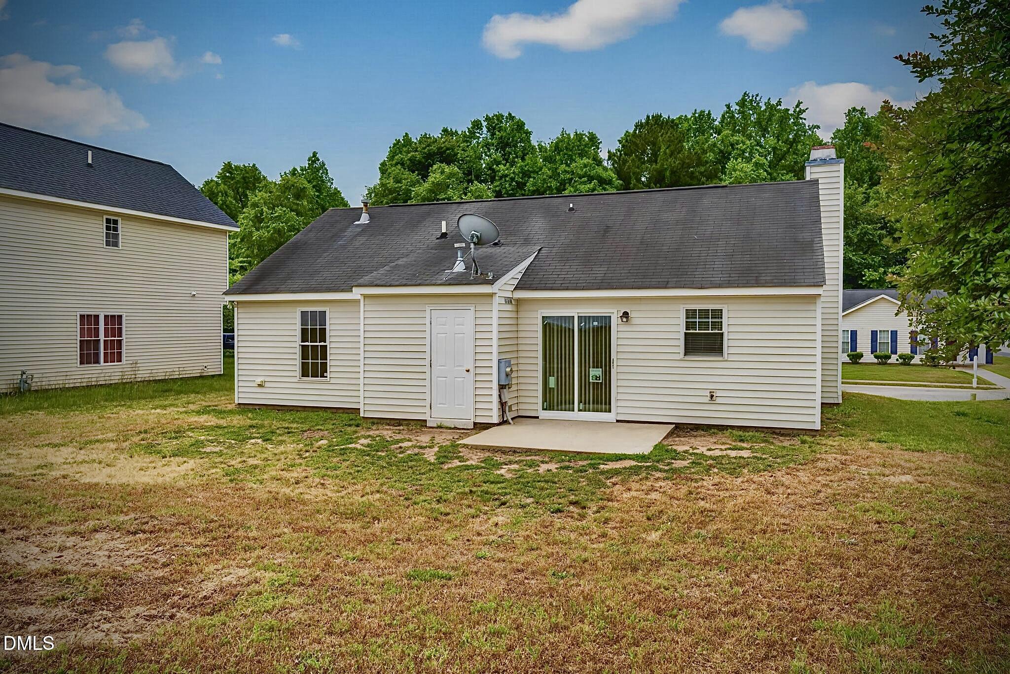 5415 Gunnette Drive Raleigh, NC 27610 - Photo 34 of 37 a view of a house with a yard