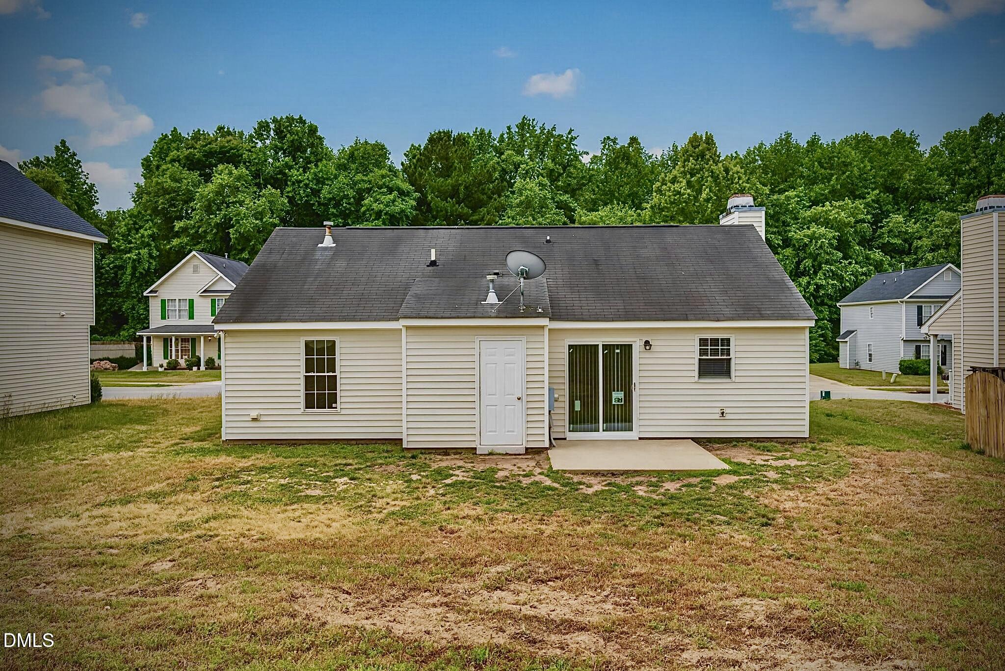 5415 Gunnette Drive Raleigh, NC 27610 - Photo 35 of 37 front view of a house with a yard