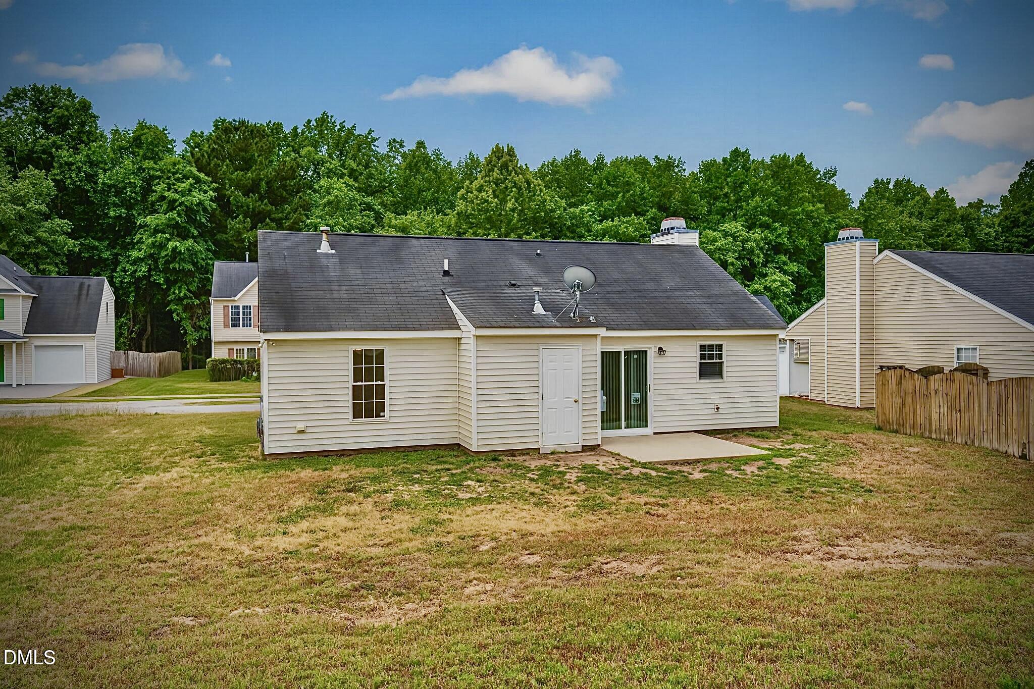 5415 Gunnette Drive Raleigh, NC 27610 - Photo 36 of 37 a view of a house with a yard