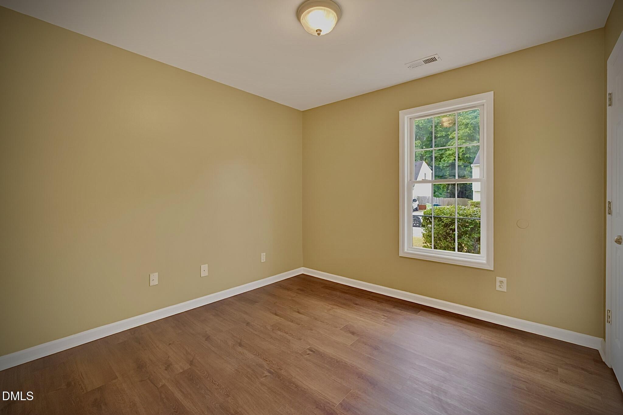5415 Gunnette Drive Raleigh, NC 27610 - Photo 7 of 37 an empty room with a window
