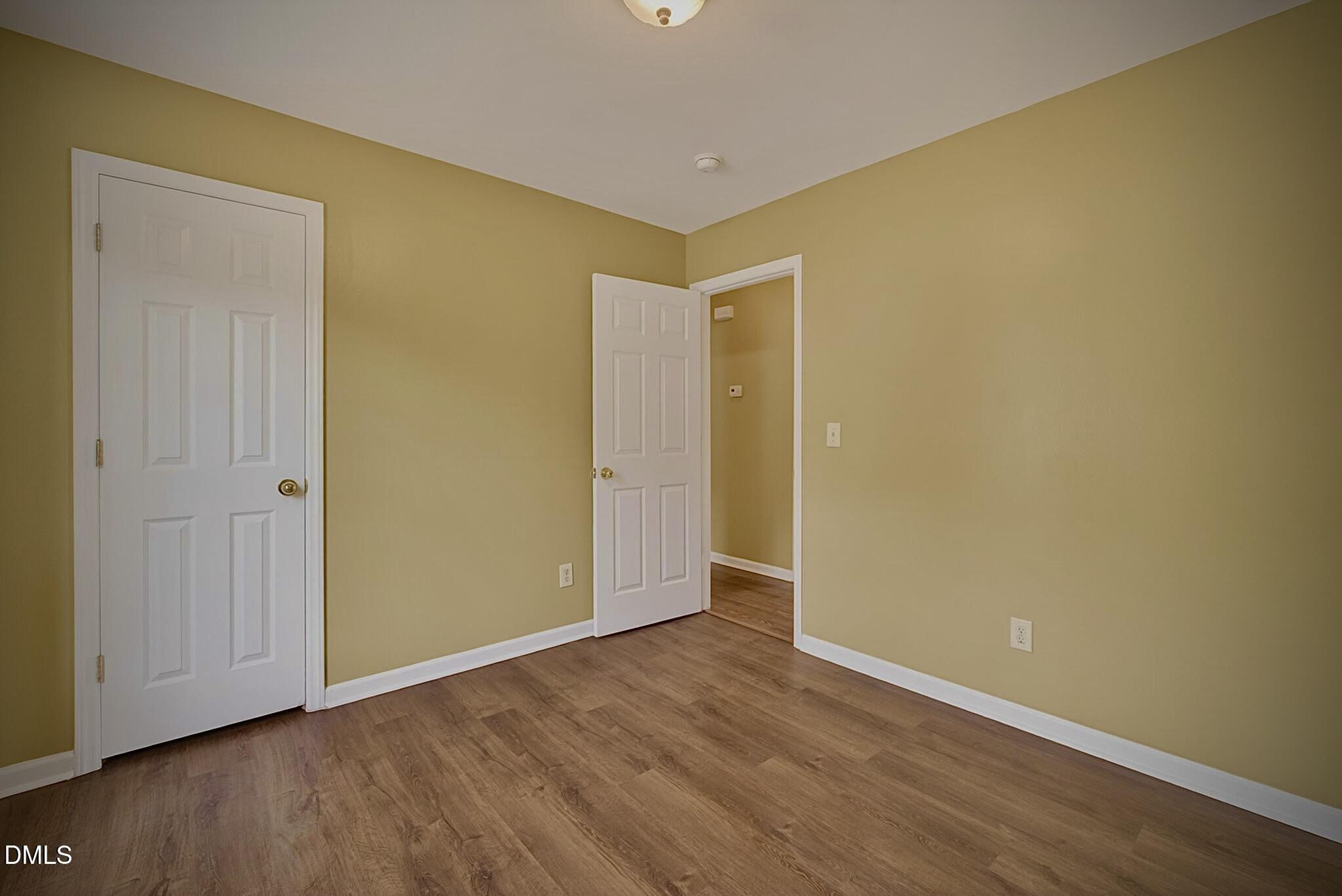 5415 Gunnette Drive Raleigh, NC 27610 - Photo 8 of 37 a view of an empty room with wooden floor