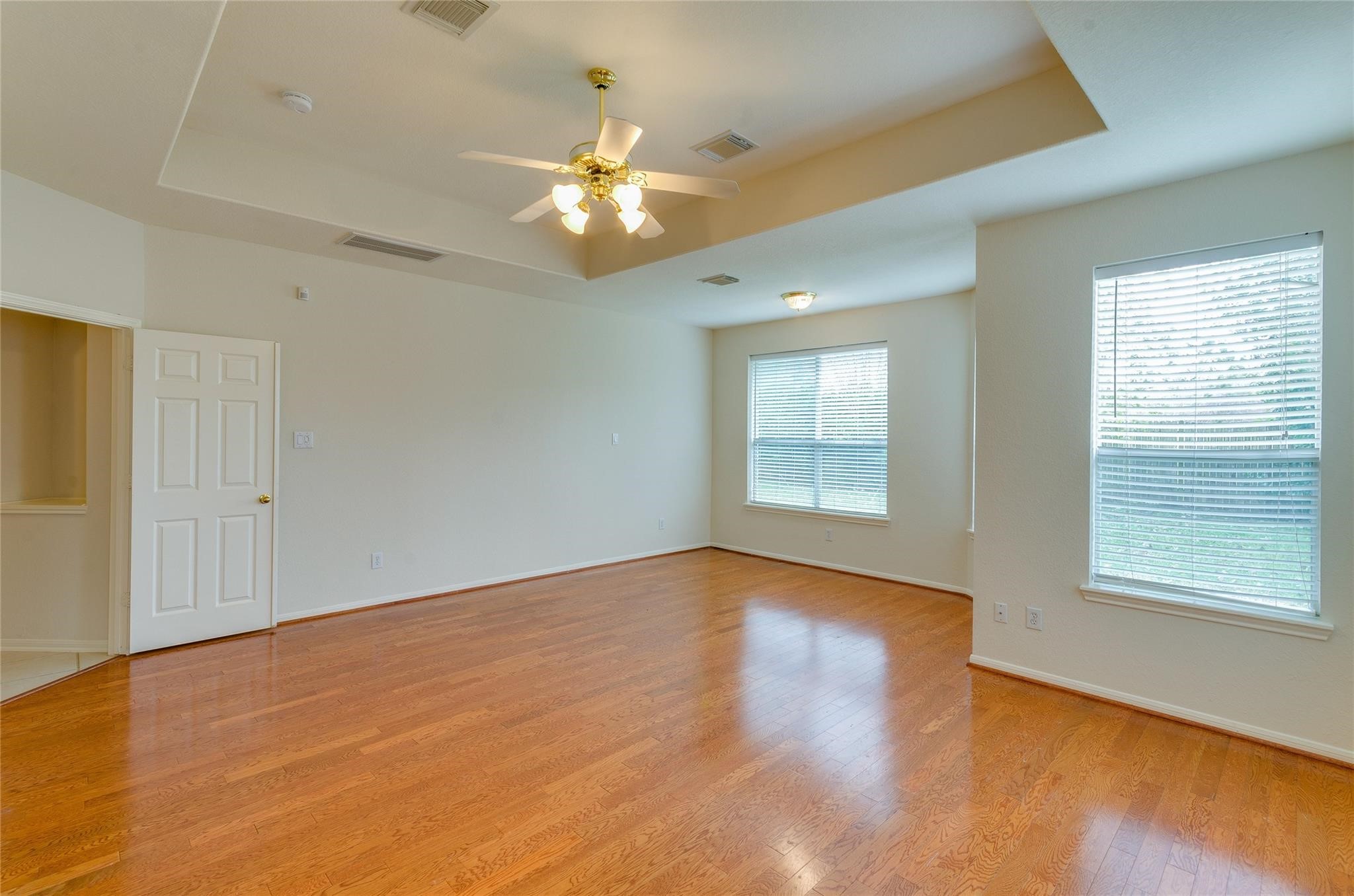 4019 Angel Spring Drive Sugar Land, TX 77479 - Photo 23 of 50 a view of an empty room with chandelier fan and fire place