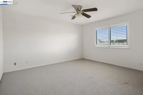 a view of a livingroom with furniture and window