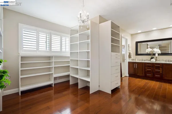 a view of closet area with empty racks