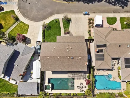 an aerial view of a house with a swimming pool