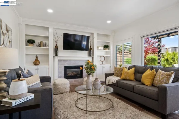 a living room with furniture and a rug