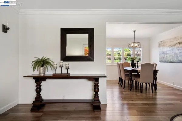 a view of a dining room with furniture window and wooden floor