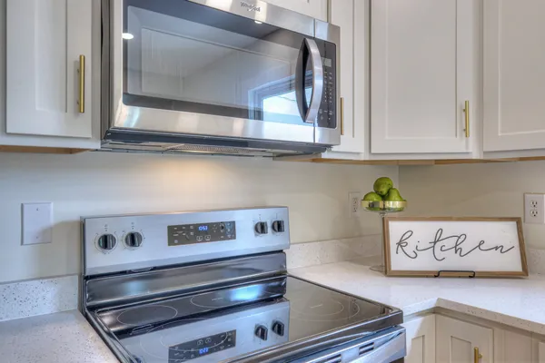 a view of a kitchen with wooden floor and a kitchen