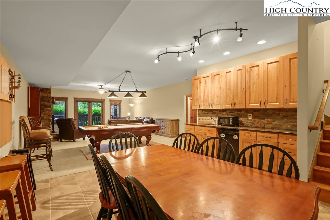 138 South Camp Road, Unit 103 Boone, NC 28607 - Photo 31 of 50 a view of a a dining room with furniture window and wooden floor