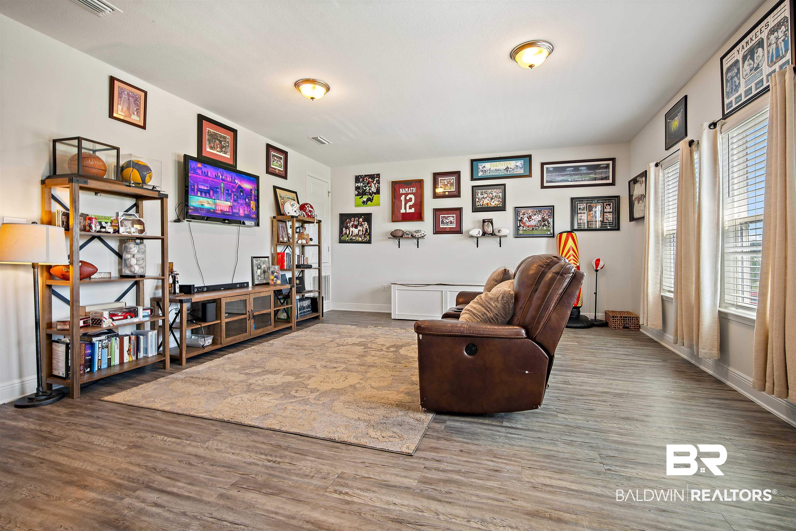 24341 Alydar Loop Daphne, AL 36526 - Photo 21 of 45 Living area featuring wood finished floors