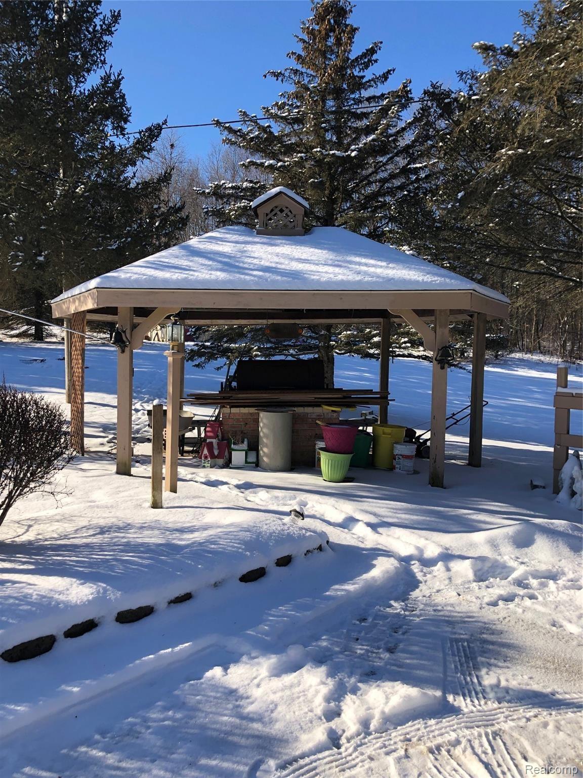 5208 Casey Road Dryden, MI 48428 - Photo 43 of 52 Cute gazebo features a BBQ large enough to roast an entire pig. Host a summer luau!