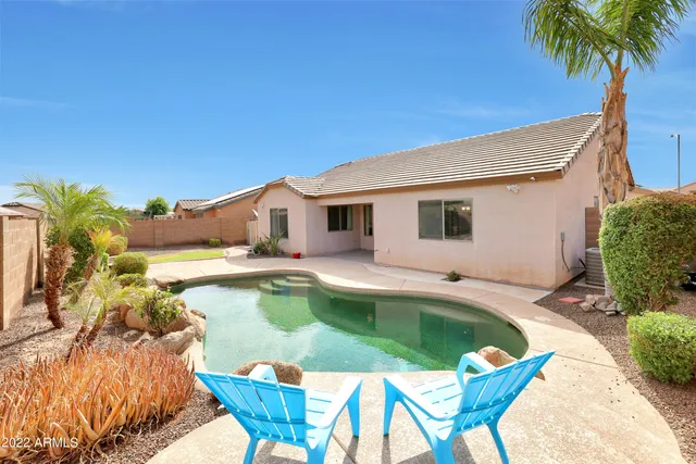 a view of a swimming pool with a patio