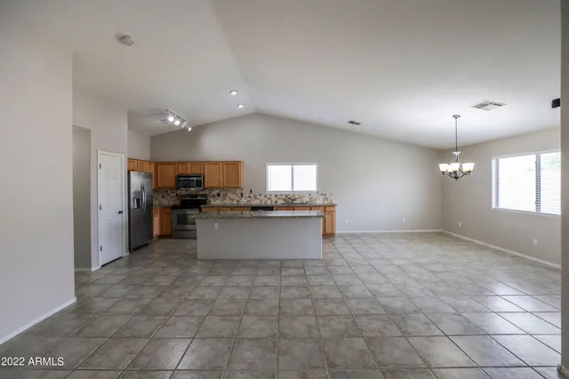 a view of a kitchen with a sink and cabinets