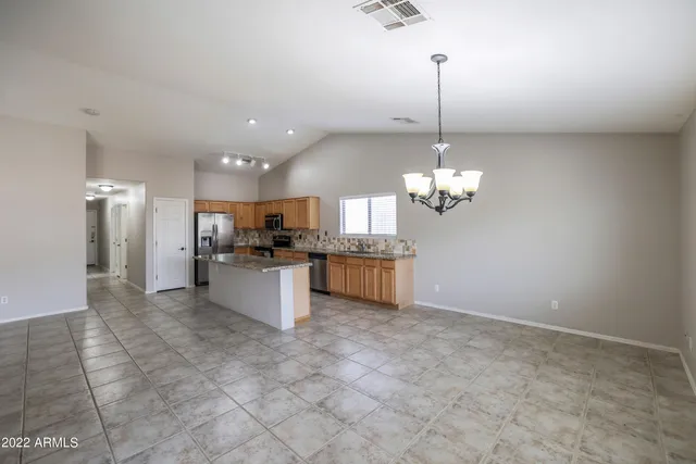 a view of a kitchen with a sink stainless steel appliances and cabinets