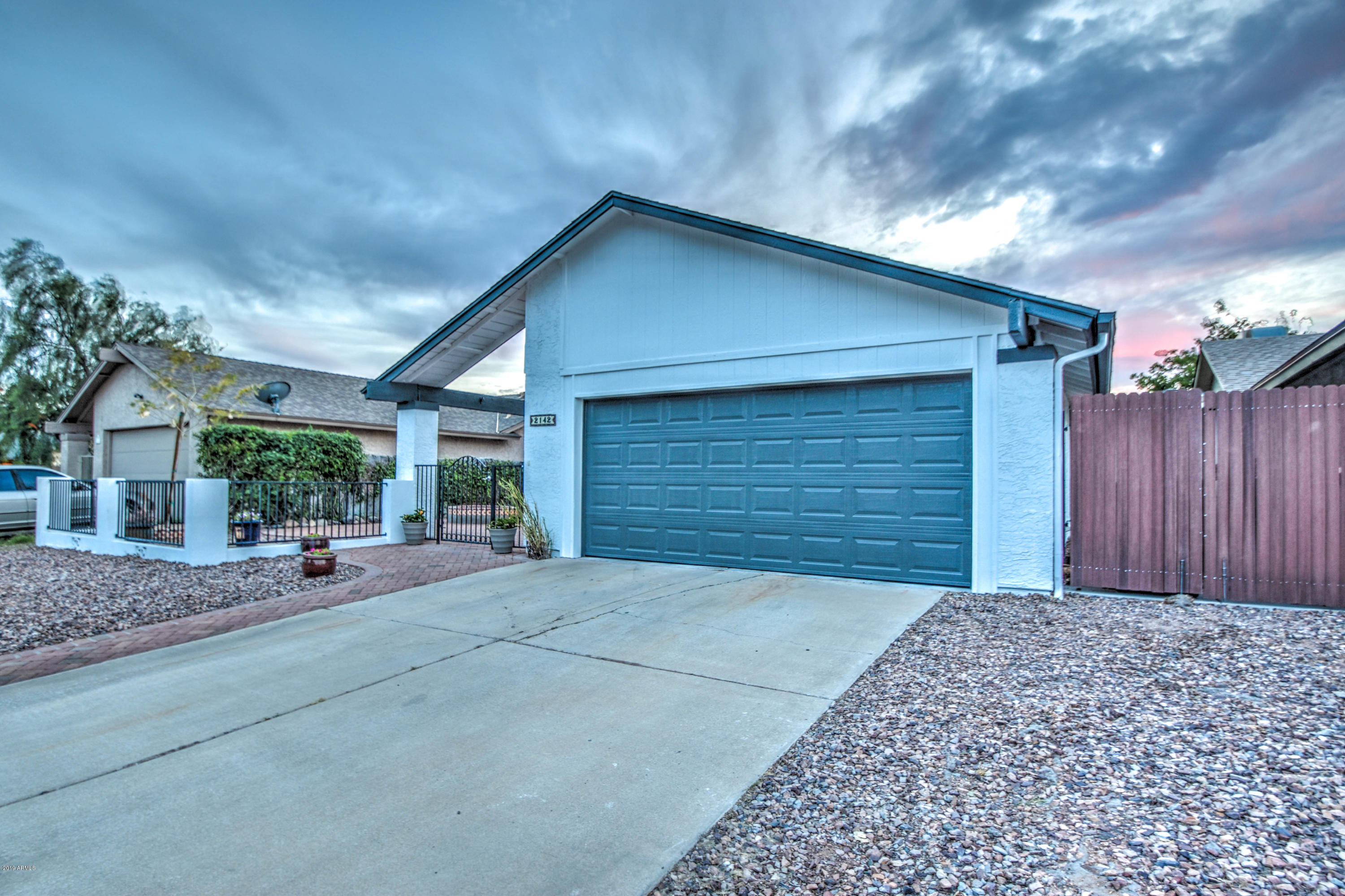 2142 West Inlet Loop Mesa, AZ 85202 - Photo 42 of 70 a front view of house with garage