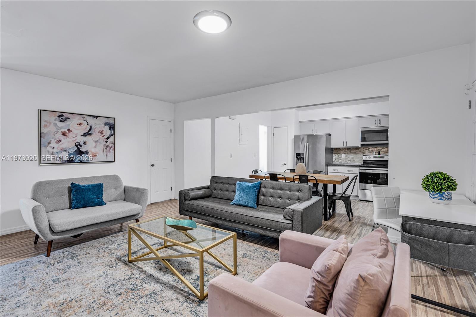 977 Southwest 10th Street, Unit 927 Miami, FL 33130 - Photo 1 of 18 a living room with furniture and a rug