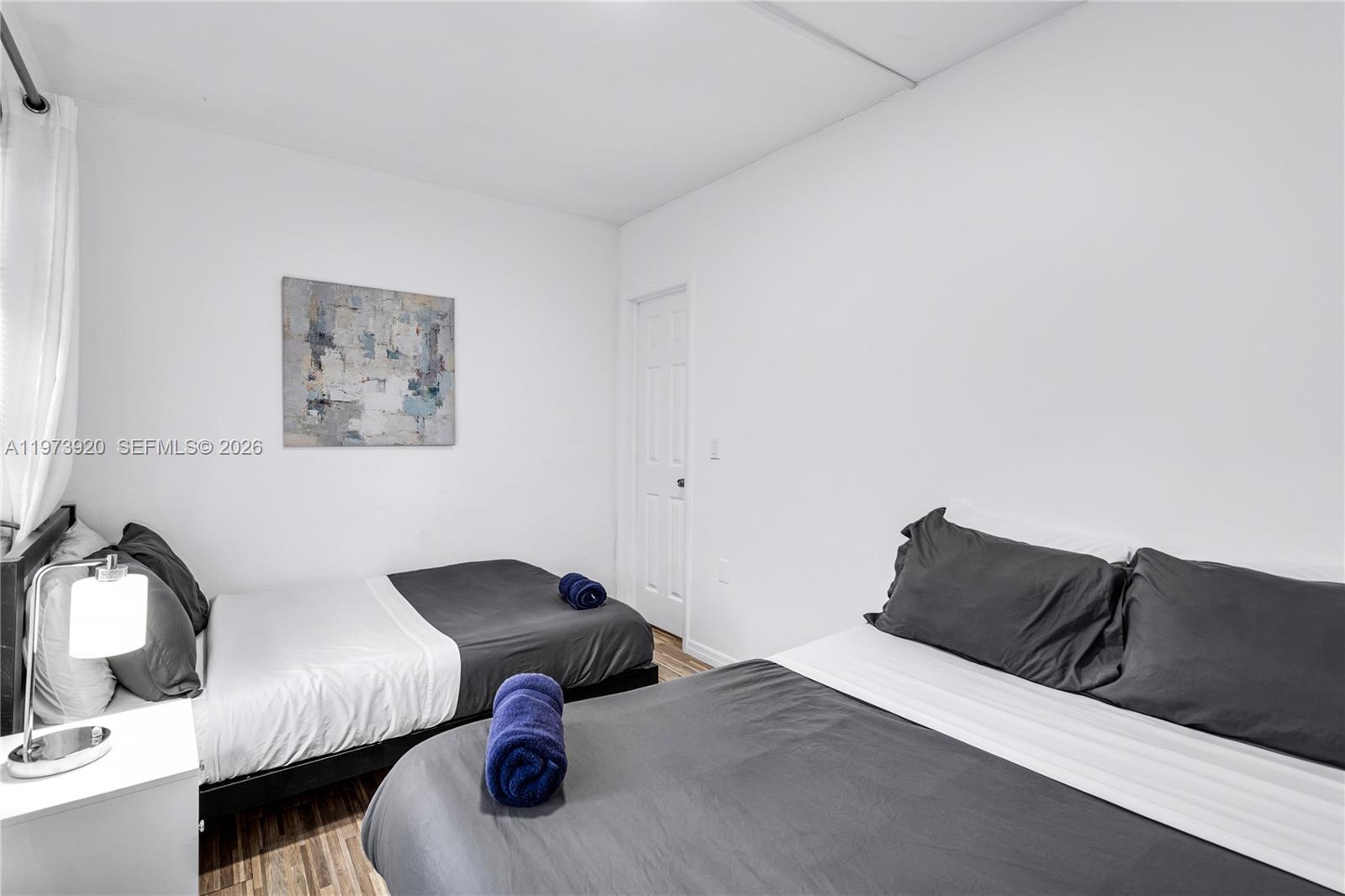 977 Southwest 10th Street, Unit 927 Miami, FL 33130 - Photo 12 of 18 a bedroom with a bed and window