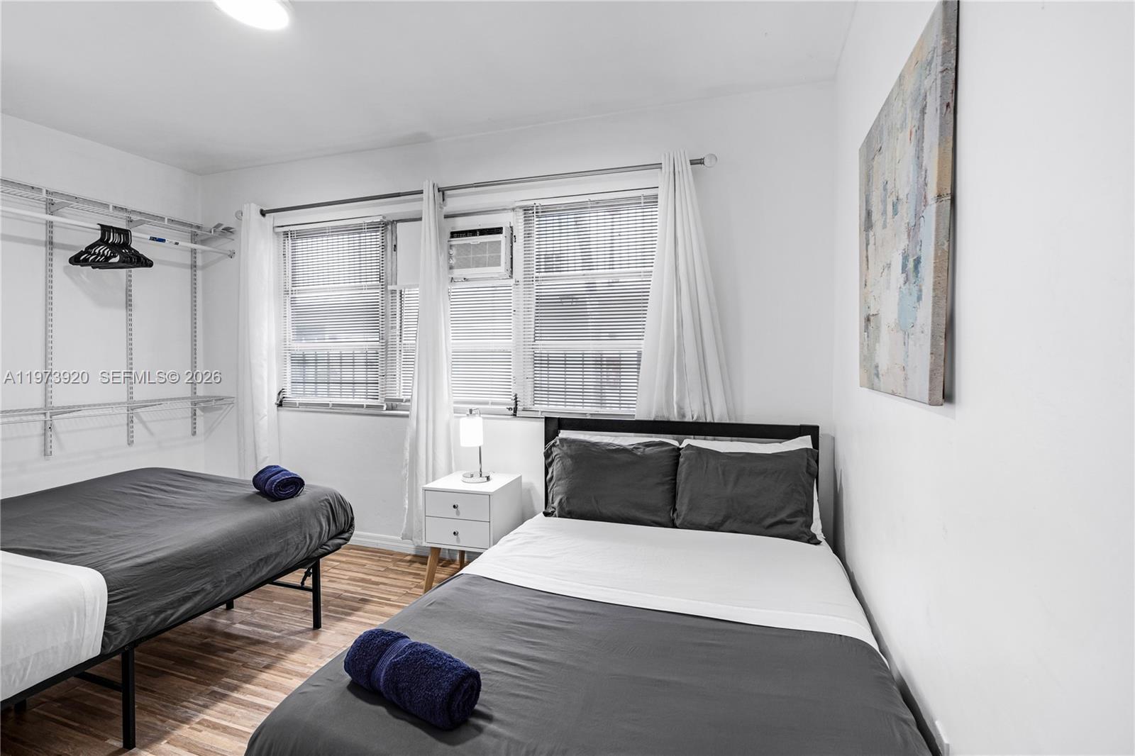 977 Southwest 10th Street, Unit 927 Miami, FL 33130 - Photo 13 of 18 a bedroom with a bed and a window