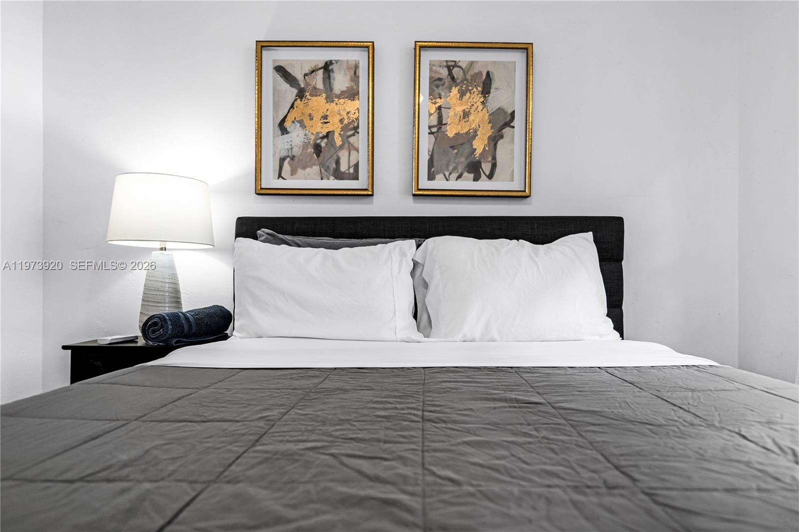 977 Southwest 10th Street, Unit 927 Miami, FL 33130 - Photo 14 of 18 a large white bed in a white room