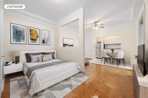 a bedroom with a bed and a chandelier