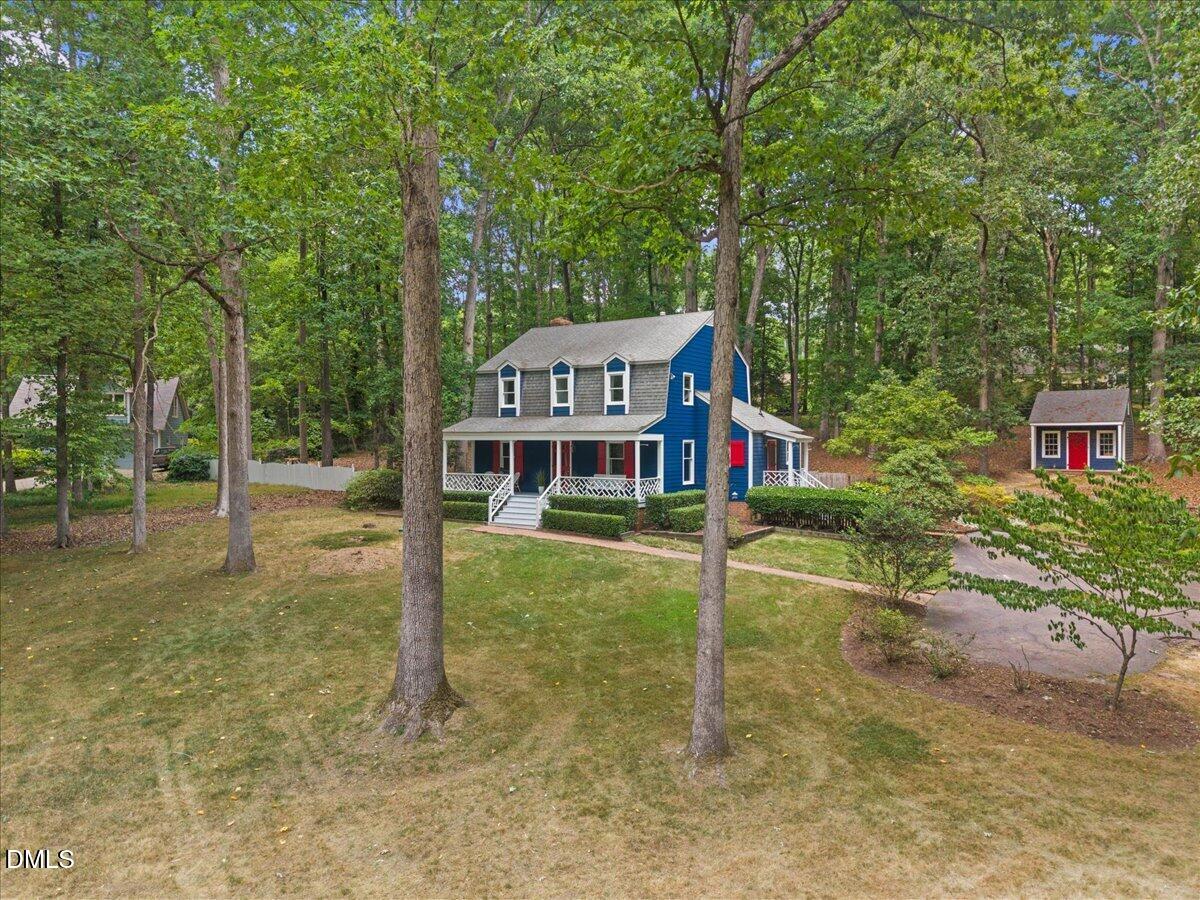 6516 Bakersfield Drive Raleigh, NC 27606 - Photo 4 of 59 front view of a house with a yard