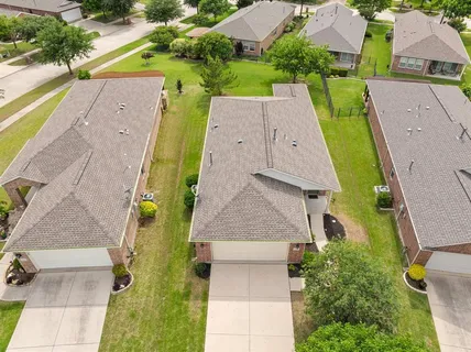 aerial view of a house with a yard