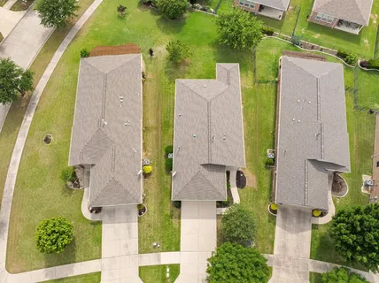 an aerial view of a house with a garden