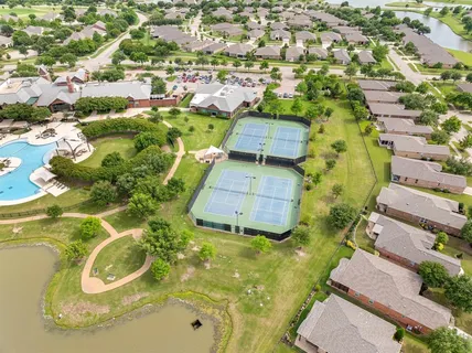 a view of a swimming pool in he middle of the house