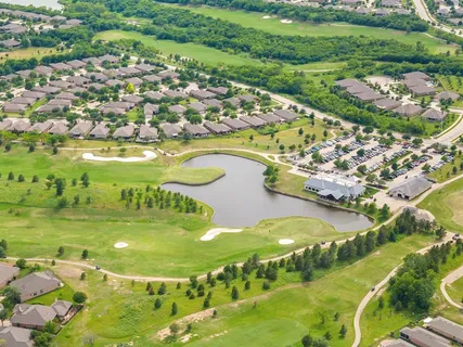 an aerial view of a house with outdoor space
