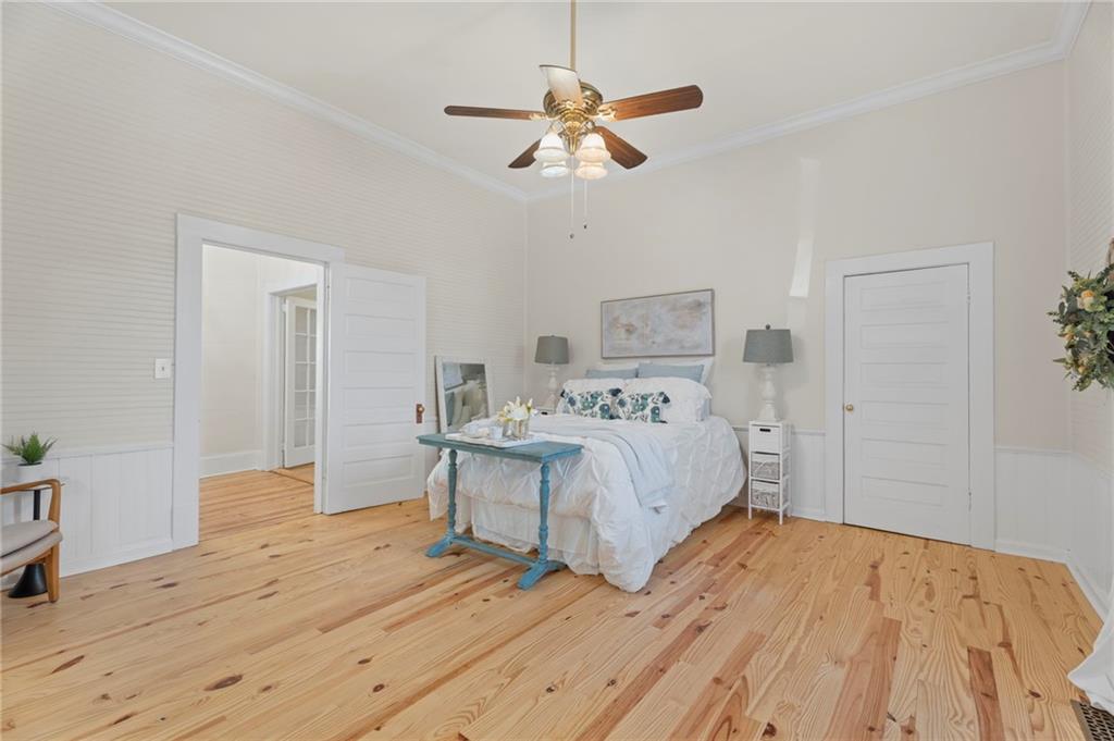 114 Cleveland Street McDonough, GA 30253 - Photo 16 of 71 a bedroom with a bed and a ceiling fan