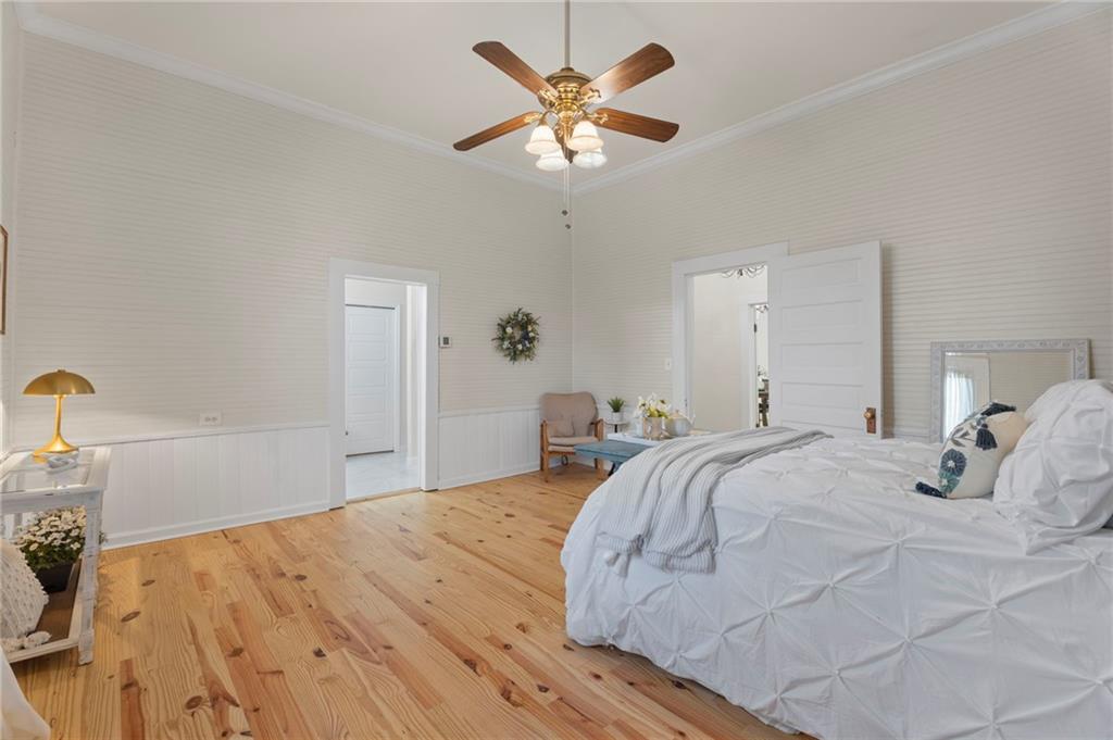 114 Cleveland Street McDonough, GA 30253 - Photo 17 of 71 a bedroom with a bed and a chandelier