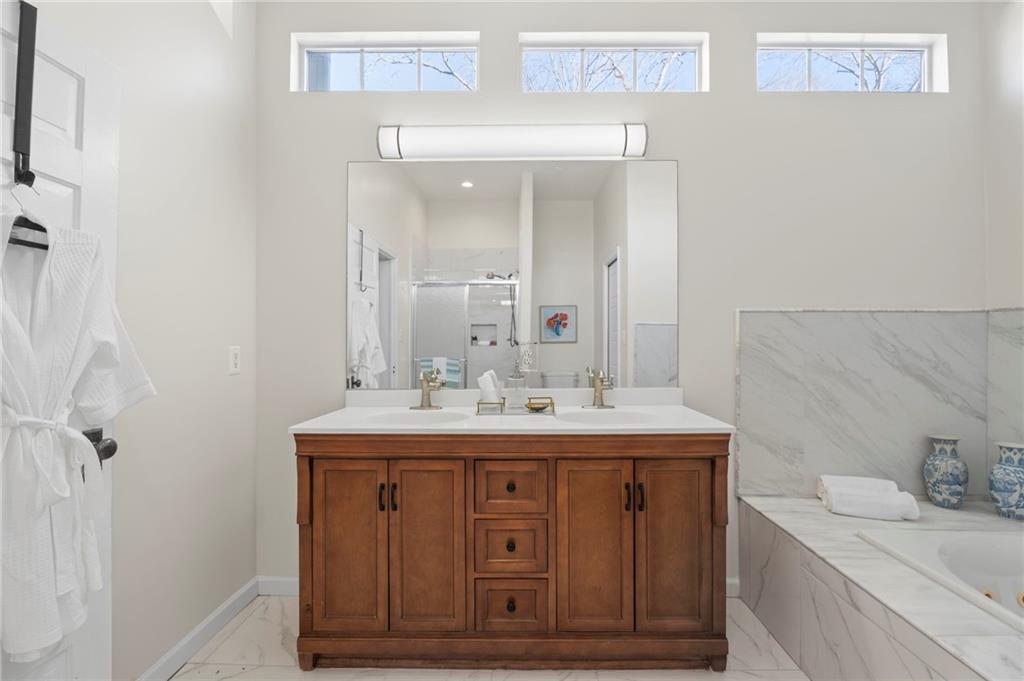 114 Cleveland Street McDonough, GA 30253 - Photo 18 of 71 a bathroom with a sink and a mirror