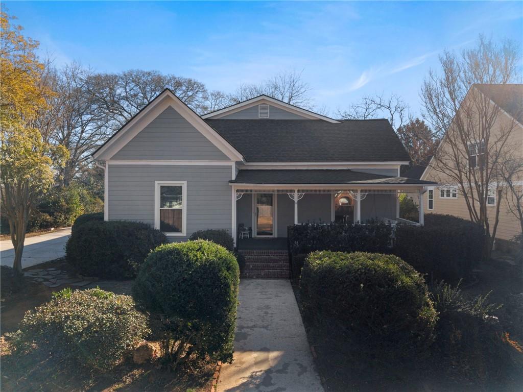 114 Cleveland Street McDonough, GA 30253 - Photo 2 of 71 a front view of house with yard and trees in the background