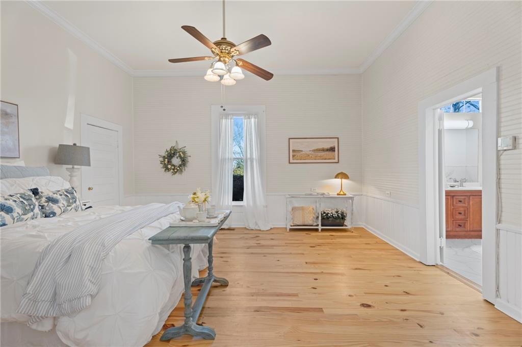 114 Cleveland Street McDonough, GA 30253 - Photo 21 of 71 a bedroom with a bed and a chandelier