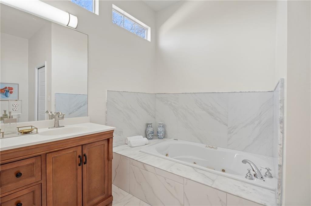 114 Cleveland Street McDonough, GA 30253 - Photo 22 of 71 a bathroom with a sink and a bathtub