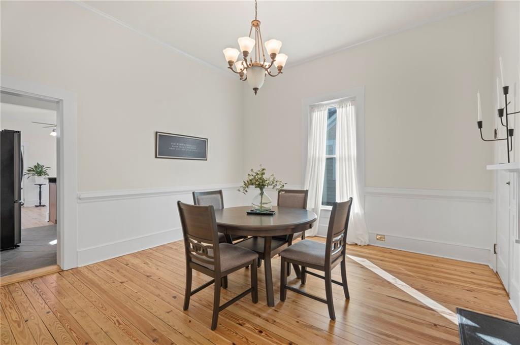 114 Cleveland Street McDonough, GA 30253 - Photo 24 of 71 a view of a dining room with furniture and wooden floor