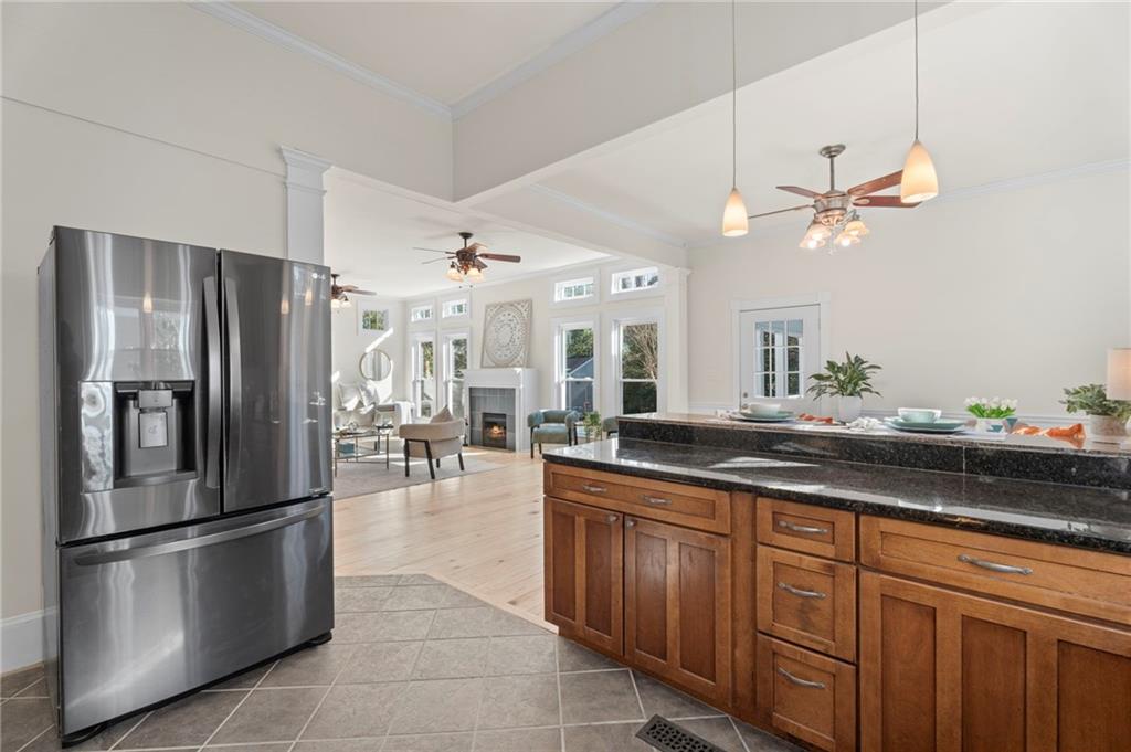 114 Cleveland Street McDonough, GA 30253 - Photo 29 of 71 a kitchen with stainless steel appliances a refrigerator a sink and a stove