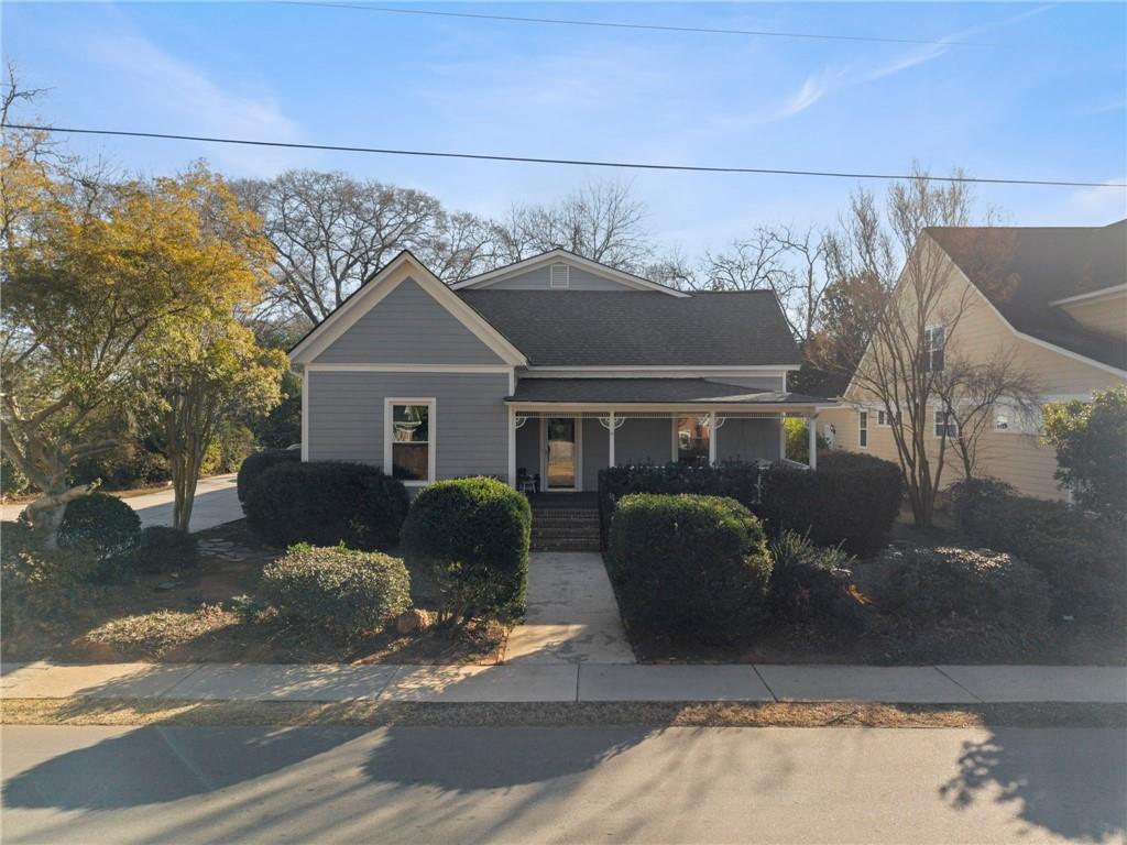 114 Cleveland Street McDonough, GA 30253 - Photo 3 of 71 a front view of a house with a garden