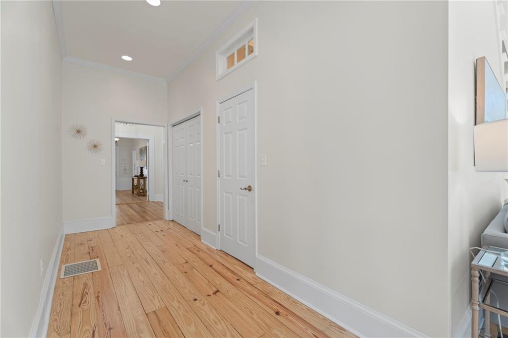 114 Cleveland Street McDonough, GA 30253 - Photo 34 of 71 a view of a hallway with wooden floor and a bathroom