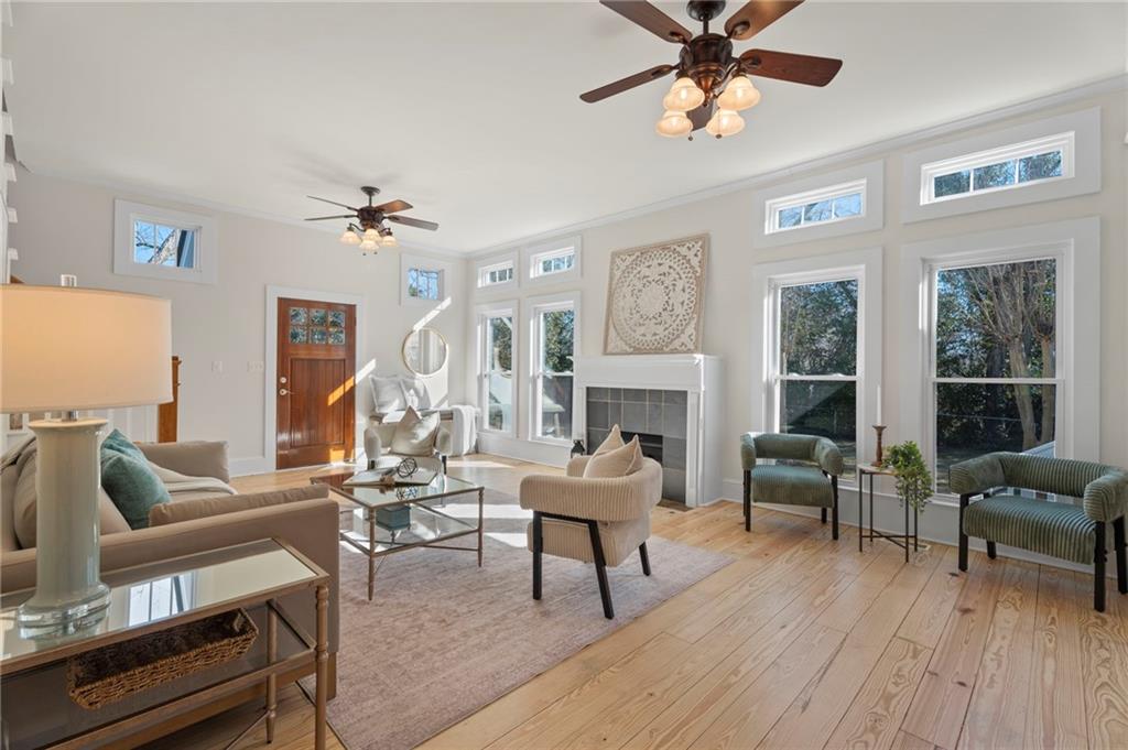 114 Cleveland Street McDonough, GA 30253 - Photo 37 of 71 a living room with furniture a fireplace and a table