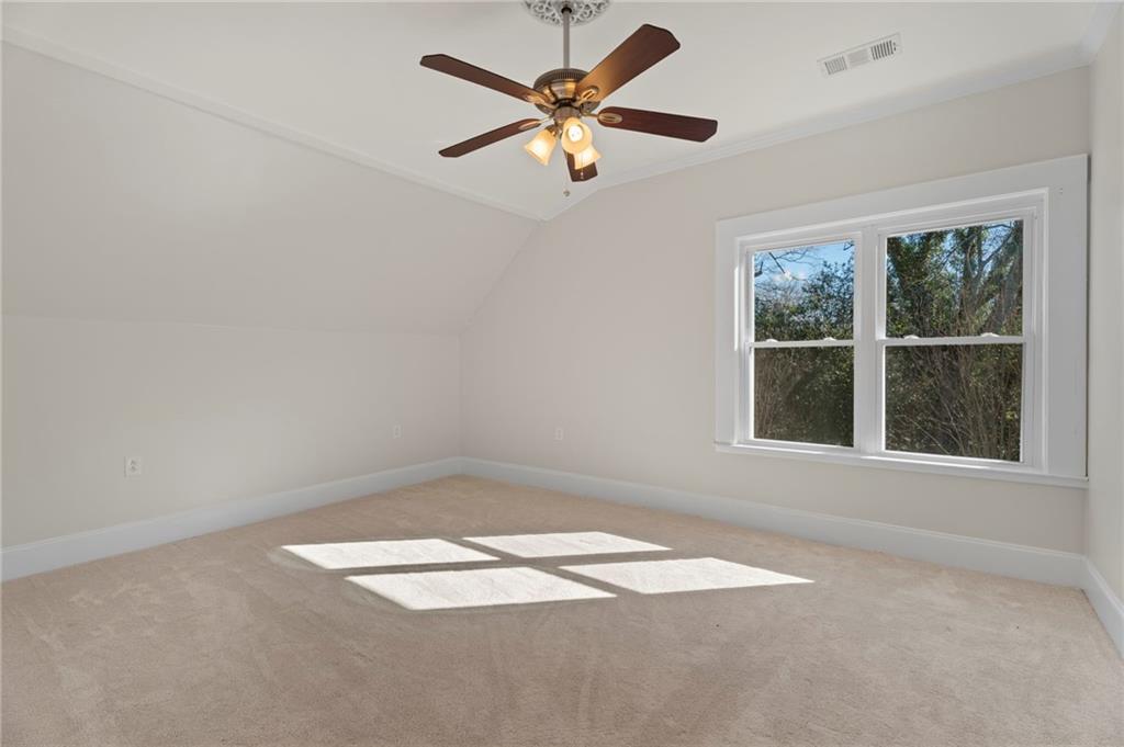 114 Cleveland Street McDonough, GA 30253 - Photo 45 of 71 an empty room with a window and a fan