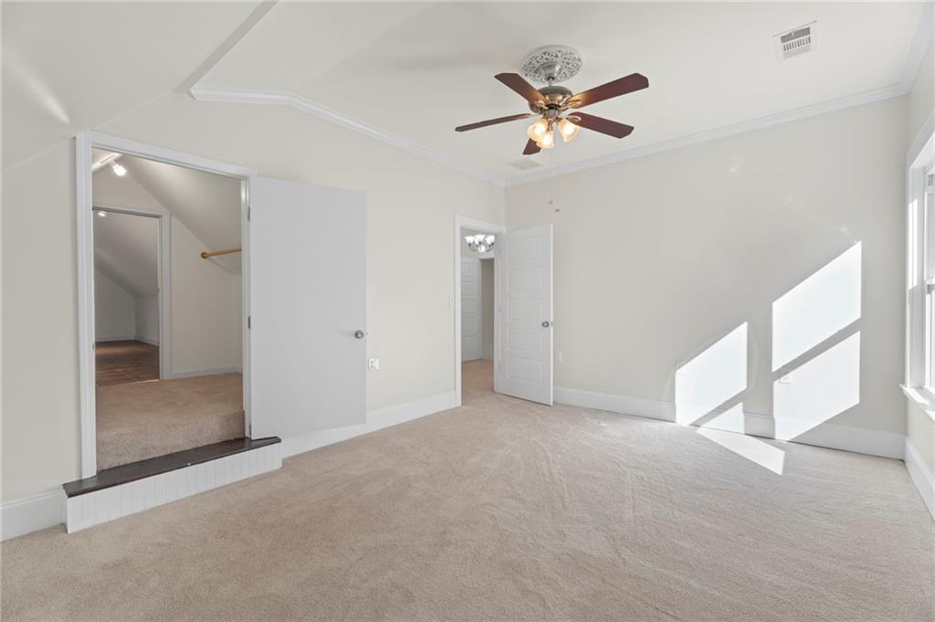 114 Cleveland Street McDonough, GA 30253 - Photo 49 of 71 an empty room with closet and a ceiling fan