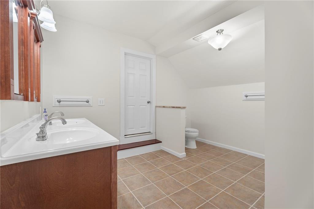 114 Cleveland Street McDonough, GA 30253 - Photo 51 of 71 a bathroom with a sink and a toilet